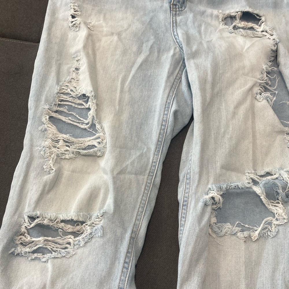 Faded Jeans with Holes & Decorative Safety Pins